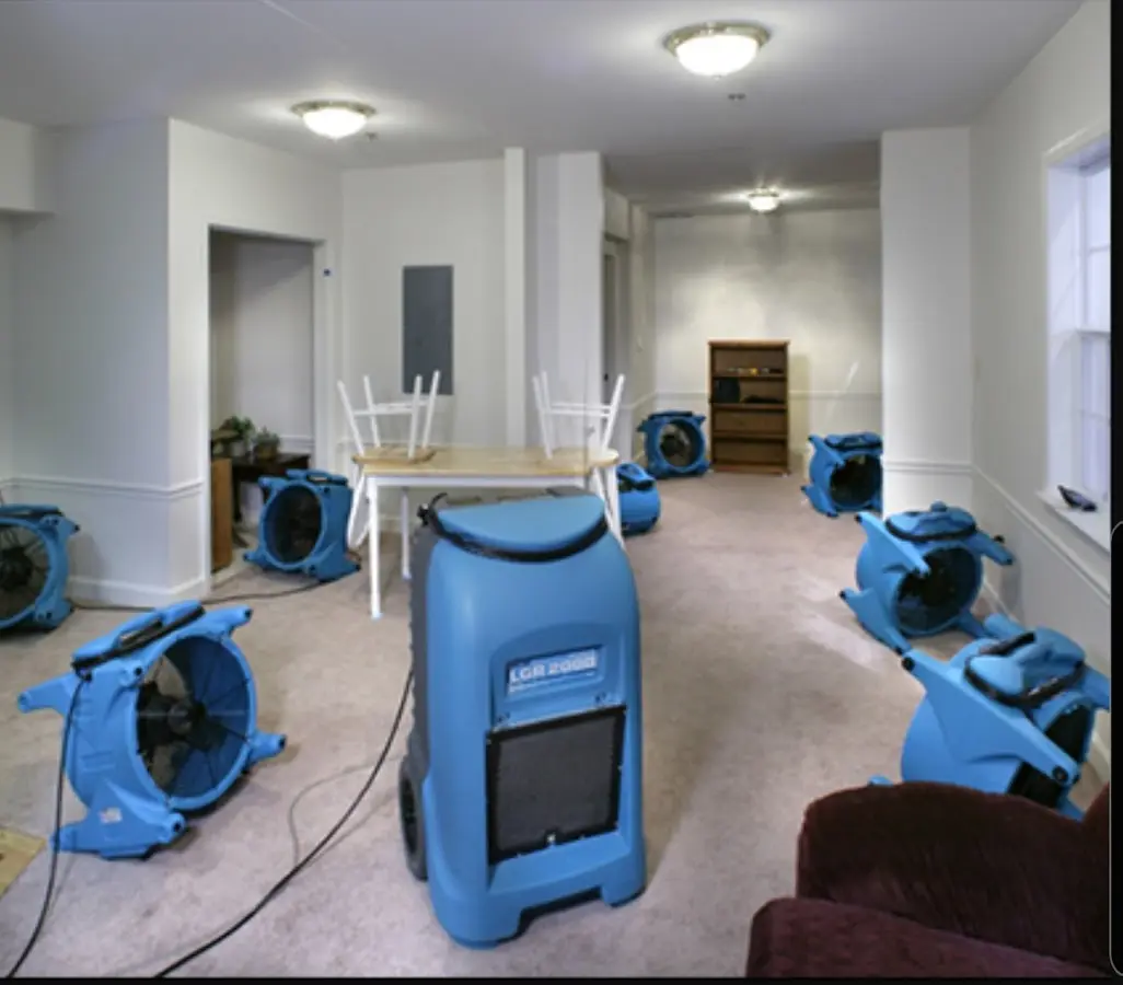 Air movers and dehumidifier setup for Water Damage Restoration in Elon